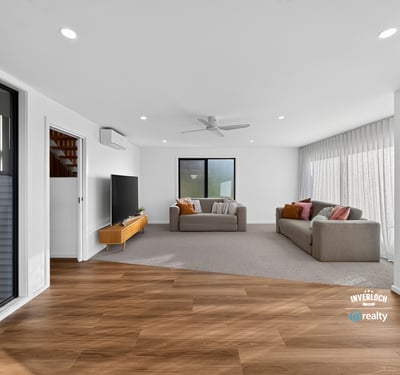 Spacious living area featuring modern finishes and ample natural light, perfect for relaxed entertaining.