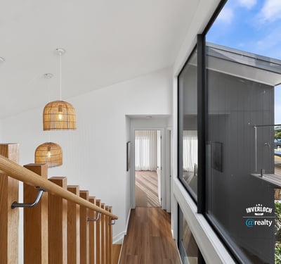 Modern open-concept design featuring natural light and unique pendant lighting, ideal for contemporary living.