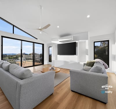 Bright and airy living space featuring large windows that showcase stunning outdoor views and modern design.
