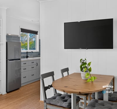 Bright open kitchen and dining area with modern appliances and inviting natural light for casual gatherings.