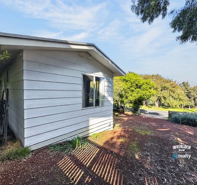 This contemporary home features a distinct design and abundant natural light in a peaceful neighborhood.