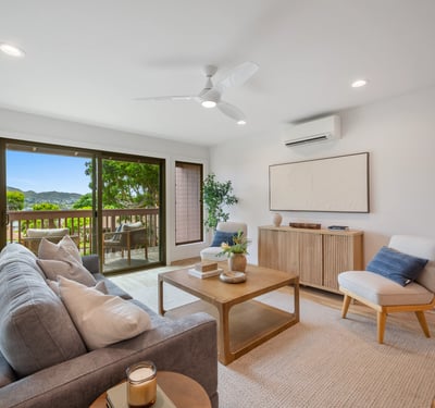 Bright and airy living room featuring modern decor and a seamless connection to outdoor views.