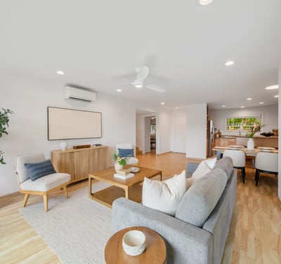 Bright and modern living space featuring an open layout, sleek furniture, and abundant natural light.