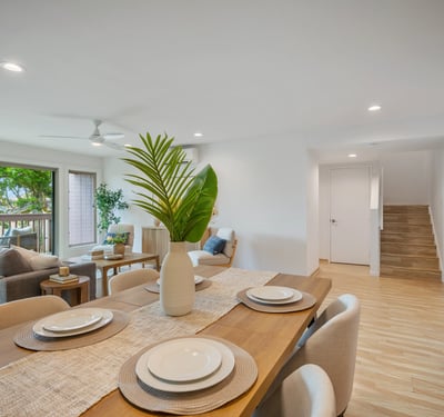 Bright and airy open-concept living space featuring a spacious dining area and modern finishes.