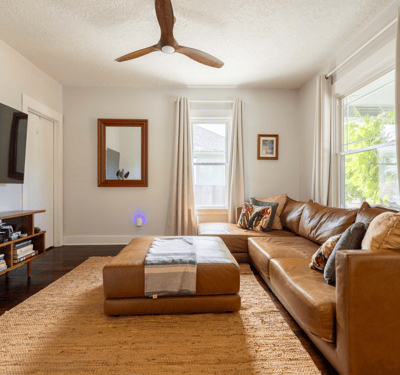 Bright and inviting living room with modern decor, large windows, and ample natural light for relaxation.