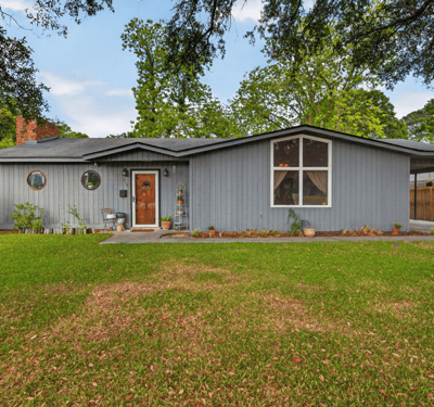 Spacious home with distinctive architecture and a landscaped yard, perfect for comfortable living and entertaining.