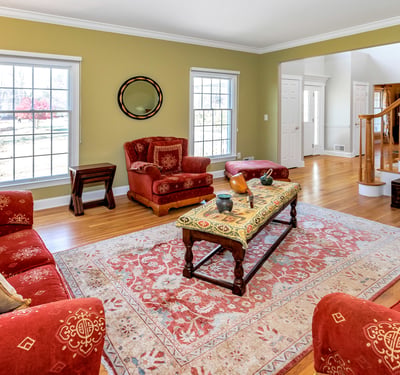 The elegant Living Room
features crown molding and hardwood flooring.