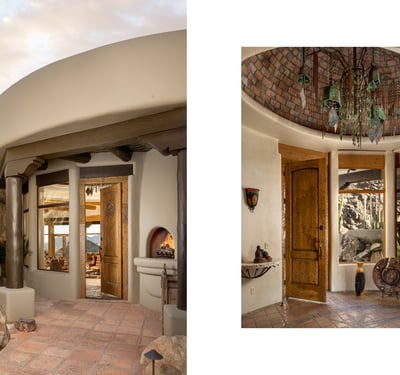 A striking combination of design and craftsmanship welcomes you at this grand entryway, where curved adobe lines, wood beam columns, and a domed brick ceiling with cascading light fixture set the tone for a truly one-of-a-kind residence. This is luxury desert living at its most artistic.