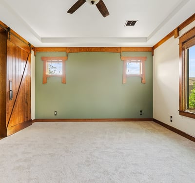 Spacious primary suite offering abundant light, soft carpeting, and calming views. Designed as a private retreat within this beautifully finished Phoenix property.