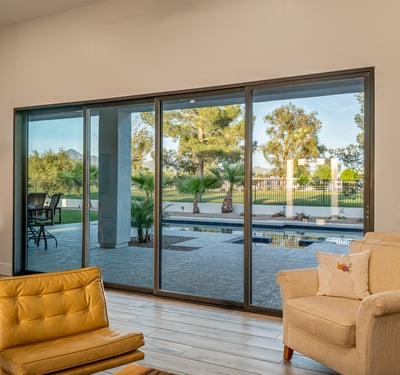 Sliding doors open to backyard views of the pool and golf course, filling the living area with light and Scottsdale charm.