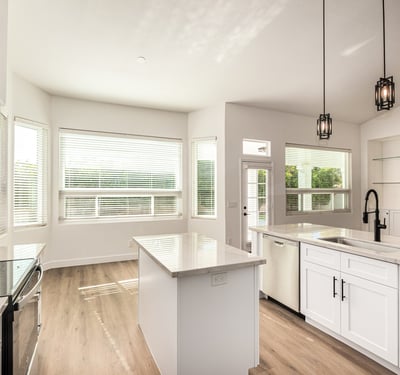 Bright Scottsdale dining area adjacent to the updated kitchen with large windows and views of the backyard. The open layout and modern finishes create an inviting environment for meals and gatherings.