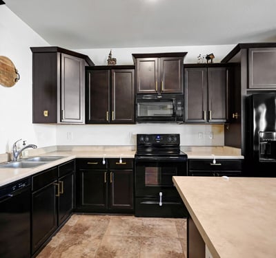 Kitchen storage highlighted by plentiful cabinetry and functional counter space, supporting organized and efficient meal prep.