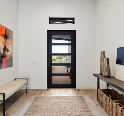 Bright interior entry featuring clean lines, neutral tones, and modern architectural details. This Scottsdale home offers a polished first impression with functional flow.