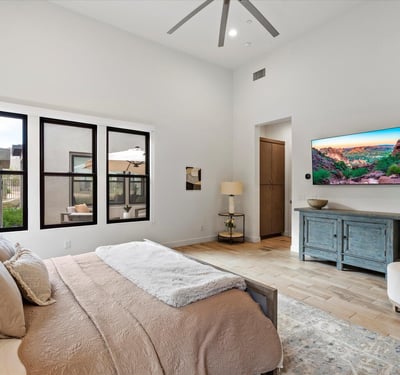 Tranquil primary suite with high ceilings and refined finishes, offering a comfortable retreat within this Scottsdale luxury property.