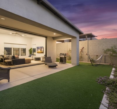 Covered patio paired with artificial turf creates an ideal outdoor living space. Designed for easy maintenance and entertaining in Scottsdale.