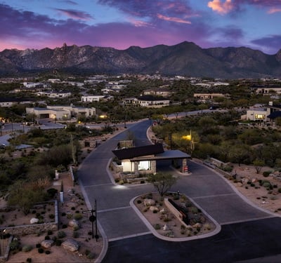 Daytime aerial of the Sereno Canyon guard-gated entrance emphasizing privacy, security, and upscale access within this Scottsdale luxury community.