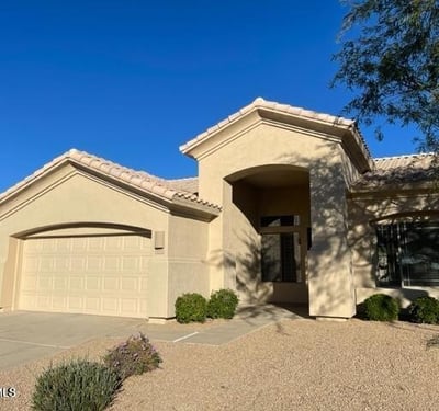 Charming Glendale exterior with stucco finish, tile roof, and desert landscaping. Designed for low maintenance and long-term durability.