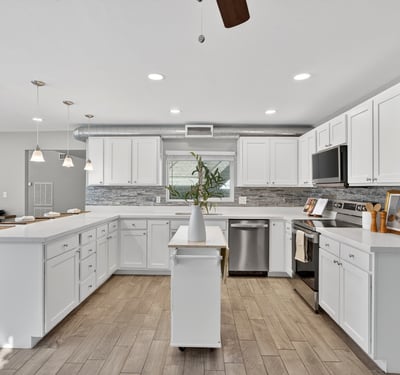 Expansive kitchen with open layout, updated cabinetry, stainless appliances, and excellent flow for entertaining in this Phoenix home.