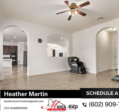 Arched architectural details frame this open living space connecting seamlessly to the kitchen. The updated floors and neutral palette make this Glendale home move-in ready.