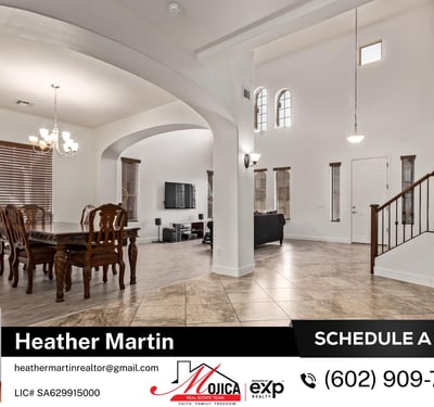 This open-concept design blends tile entry and wood-look flooring for visual warmth. High ceilings and elegant arches add architectural charm to this Glendale residence.