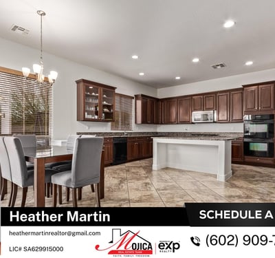 Recessed lighting and abundant cabinetry define this spacious kitchen and dining area. Granite countertops and stainless steel appliances elevate the functionality of this Glendale home.