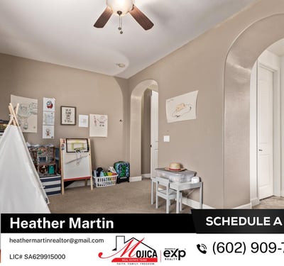 This inviting secondary bedroom includes plush carpet, ceiling fan, and neutral paint tones. A functional and cozy space within this Glendale home featuring updated kitchen and backyard pool.