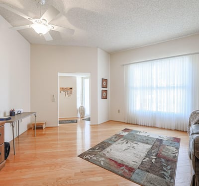 Large bonus room with natural light and open layout, perfect for a home office, hobby room, or additional living space.