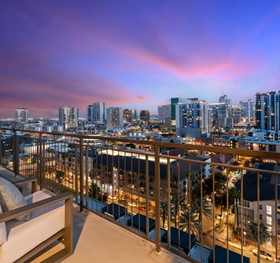 Inviting balcony space with seating and sweeping city views, ideal for relaxing and enjoying the Phoenix skyline.