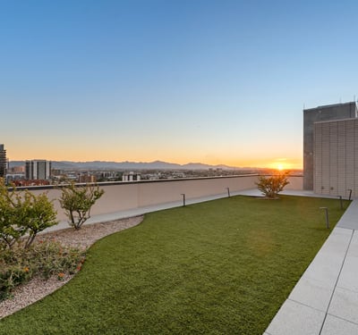 Elevated rooftop capturing colorful sunset skies and cityscape views, perfect for relaxing evenings in Phoenix.