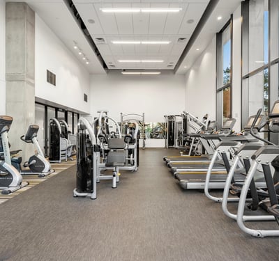 Well-appointed gym with cardio and strength training equipment, offering convenience and modern amenities in this Phoenix community.