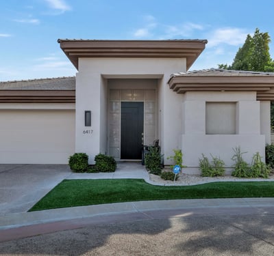 Clean-lined exterior with a private entry and attached garage in a sought-after Phoenix gated community. Designed for low-maintenance living and modern appeal.