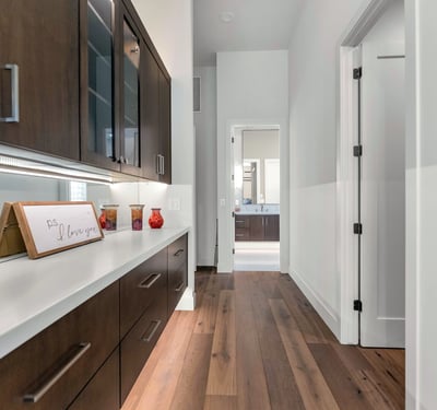 Custom hallway cabinetry with quartz countertop, adding storage and convenience to this well-designed Phoenix home.
