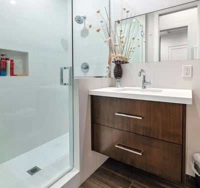 Contemporary bathroom featuring a glass-enclosed shower, modern vanity, and clean design elements in this updated Phoenix residence.