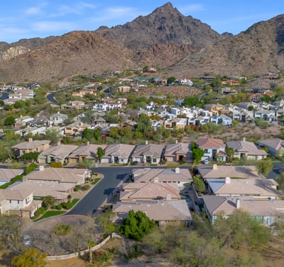 Elevated view of homes nestled in the Phoenix foothills, offering a blend of desert scenery and residential comfort.