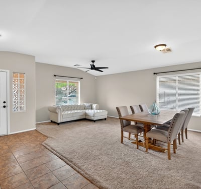 Large living and dining space with high ceilings and natural light. Flexible layout supports entertaining and comfortable living in Casa Grande.
