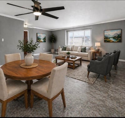 Stylish open concept living and dining space with modern flooring and ceiling fan. This Sun City home features updated interiors perfect for entertaining and everyday comfort