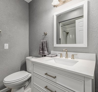 Updated bathroom with contemporary vanity, fixtures, and lighting. This Sun City home showcases refreshed interiors and stylish upgrades.