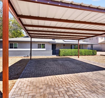 Extended driveway with direct unit access supports tenant convenience and enhances the usability of this Phoenix rental property.