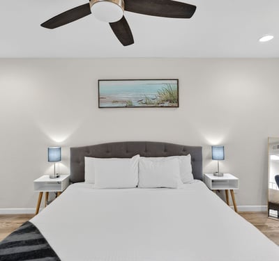 Open and inviting Scottsdale primary bedroom with updated finishes, generous space, and a calming neutral palette.