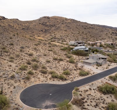 Exceptional hillside lot bordering protected preserve land, offering privacy, scenic desert terrain, and direct access to hiking and biking trails. A rare opportunity to build surrounded by untouched natural beauty.