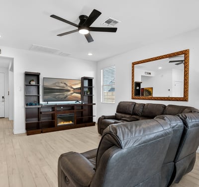 This welcoming living area showcases an open-concept design with modern finishes, abundant natural light, and comfortable gathering spaces that flow seamlessly throughout the home.