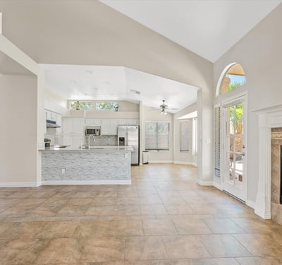 Enjoy an inviting open floor plan where the updated kitchen overlooks the spacious family room with a cozy fireplace and vaulted ceilings. Natural light and backyard access complete this comfortable living space.