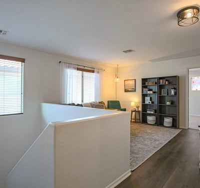 Comfortable loft with updated flooring, entertainment space, and plenty of room for movie nights, gaming, reading, or creating the perfect family retreat.