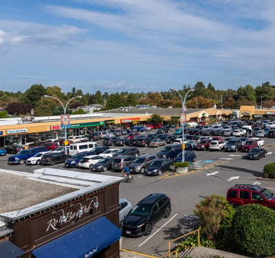 Spacious Ross Bay commercial centre featuring diverse shops and ample parking, conveniently located in a vibrant community.