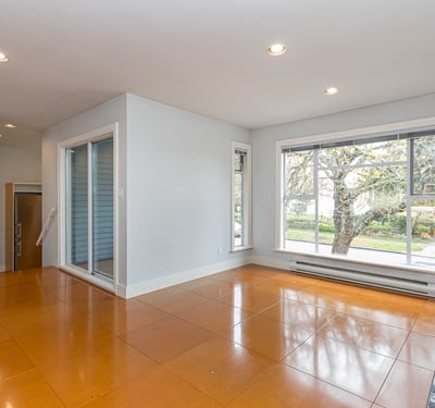 Bright, open living space featuring large windows and easy access to outdoor views and natural light.