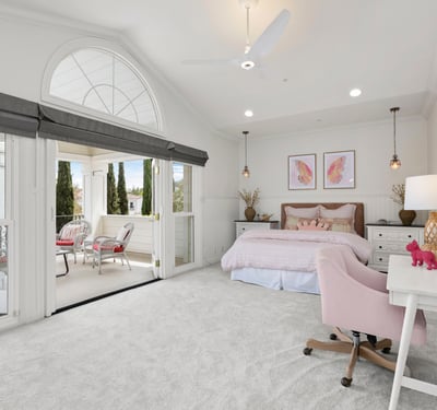 Bedroom 4-Bright and airy bedroom featuring a cozy sitting area, large windows, and modern furnishings with direct access to you own private front balcony.