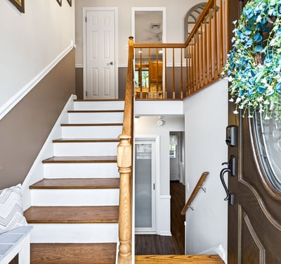 Welcoming entry with staircase up to main rooms.