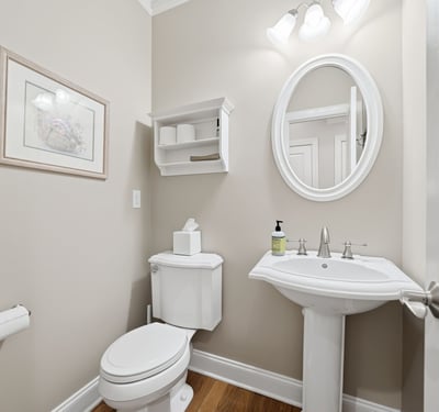 Bright and functional half bath featuring modern fixtures and a clean, inviting atmosphere.