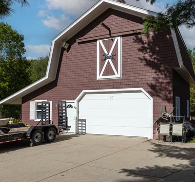 Spacious barn-garage, featuring ample parking and a versatile layout, perfect for various lifestyle needs.