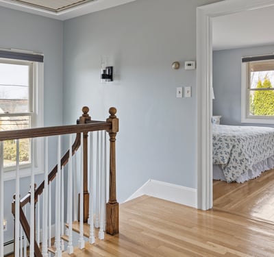 Bright and inviting, this well-lit landing leads to a cozy bedroom with lovely views.